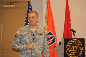 Maj. Gen. Stuart Dyer, USA, commander, 335th Signal Command (Theater), addresses chapter members on the critical role of the 335th Signal Command at the June meeting.